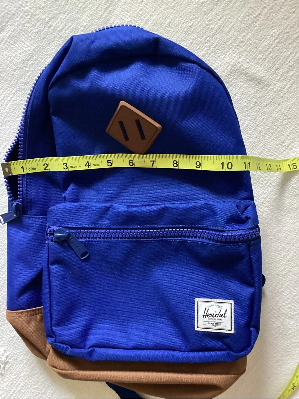 Herschel Supply Co. Heritage youth backpack in a blue and brown colorway.